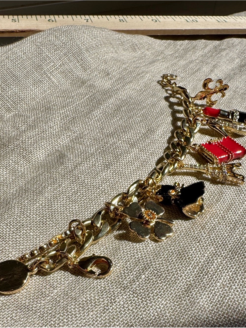 Signed Graziano Gold-Tone Charm Bracelet with Black and Red Enamel Accents